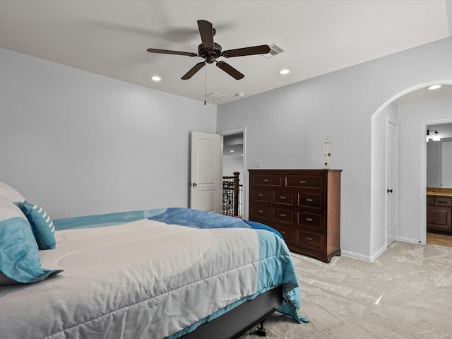 913 Ember Hills Ln, Friendswood, TX 77546 - bedroom featuring arched walkways, light carpet, baseboards, recessed lighting, and ceiling fan