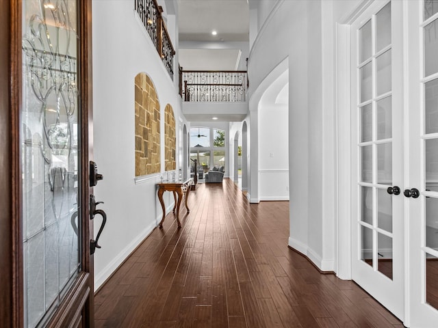 913 Ember Hills Ln, Friendswood, TX 77546 - foyer featuring arched walkways, baseboards, dark wood finished floors, and french doors
