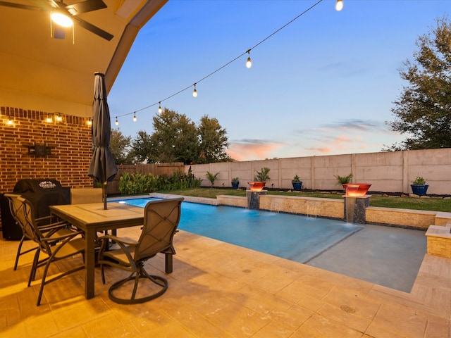 913 Ember Hills Ln, Friendswood, TX 77546 - pool at dusk featuring a fenced backyard and a patio area