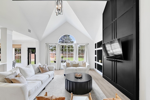 22802 Pennyrile Ln, Katy, TX 77450 - living area featuring light wood-type flooring and high vaulted ceiling