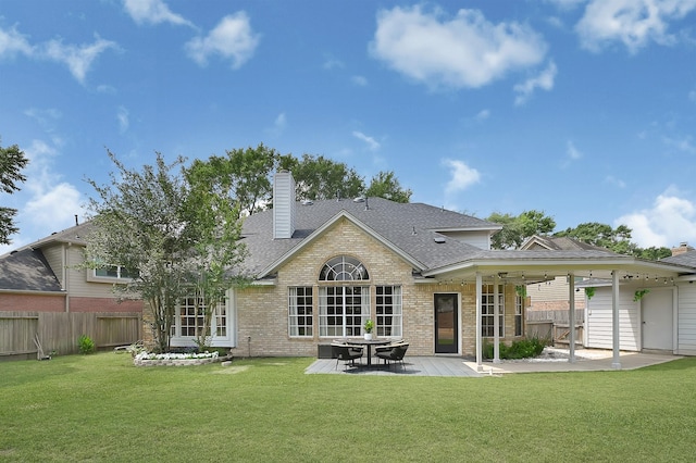 22802 Pennyrile Ln, Katy, TX 77450 - back of property featuring a patio, a chimney, brick siding, and a shingled roof