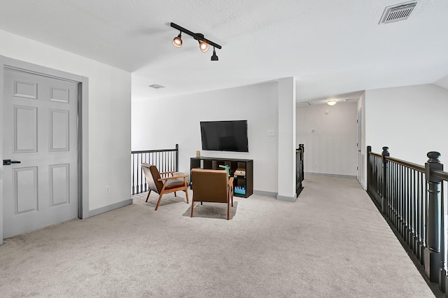 22802 Pennyrile Ln, Katy, TX 77450 - sitting room featuring an upstairs landing, light colored carpet, and baseboards