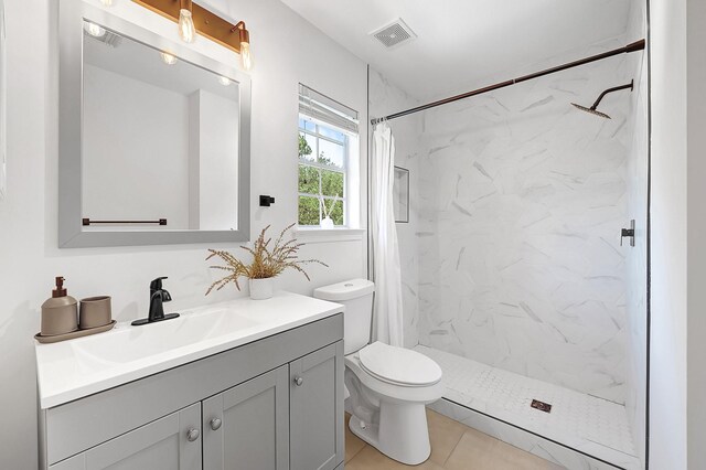 22802 Pennyrile Ln, Katy, TX 77450 - bathroom featuring vanity, a marble finish shower, toilet, and tile patterned floors