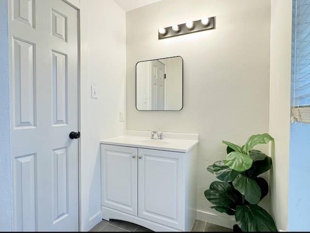 22802 Pennyrile Ln, Katy, TX 77450 - bathroom with baseboards, vanity, and tile patterned floors