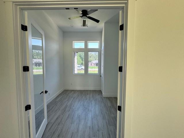 409 Rd 66111, Dayton, TX 77535 - entryway featuring baseboards, wood finished floors, and a ceiling fan