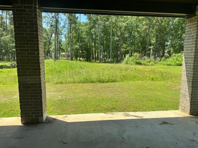 409 Rd 66111, Dayton, TX 77535 - view of yard featuring a patio area