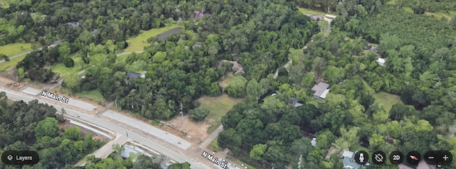 1408 N Main St, Highlands, TX 77562 - aerial view of property and surrounding area featuring a forest