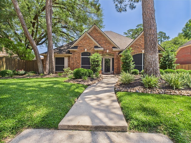 4210 Rock Springs Dr, Houston, TX 77345 - view of front of house featuring brick siding and a shingled roof