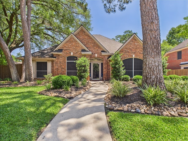 4210 Rock Springs Dr, Houston, TX 77345 - view of front of home featuring brick siding and roof with shingles
