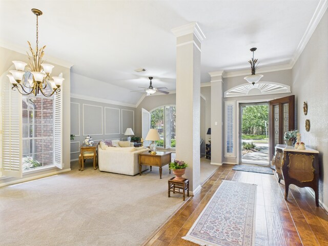 4210 Rock Springs Dr, Houston, TX 77345 - entrance foyer with plenty of natural light, hardwood / wood-style flooring, ornamental molding, a chandelier, and a ceiling fan