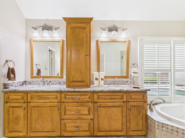 4210 Rock Springs Dr, Houston, TX 77345 - full bathroom featuring double vanity and a relaxing tiled tub