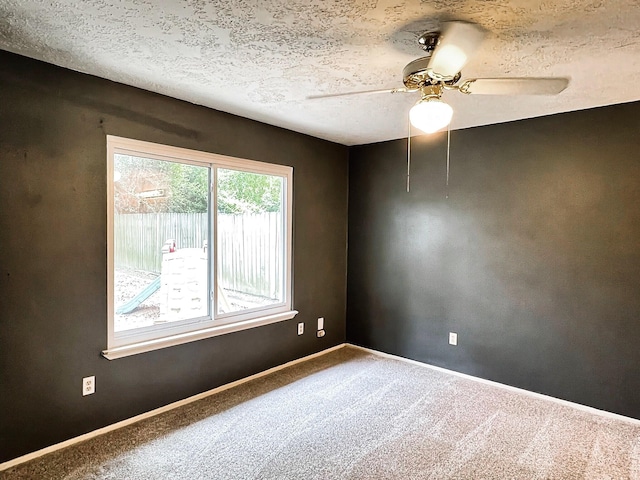 21510 N Tangle Creek Ln, Spring, TX 77388 - carpeted empty room featuring ceiling fan, a textured ceiling, and baseboards
