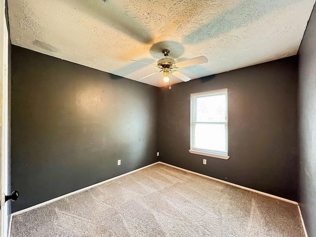 21510 N Tangle Creek Ln, Spring, TX 77388 - empty room featuring a textured ceiling, carpet flooring, a ceiling fan, and baseboards