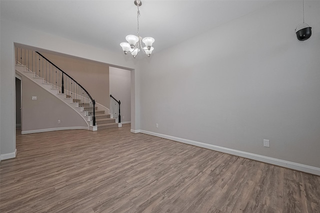 707 Fresh Sage Xing, Richmond, TX 77406 - unfurnished living room with stairs, wood finished floors, baseboards, and a chandelier