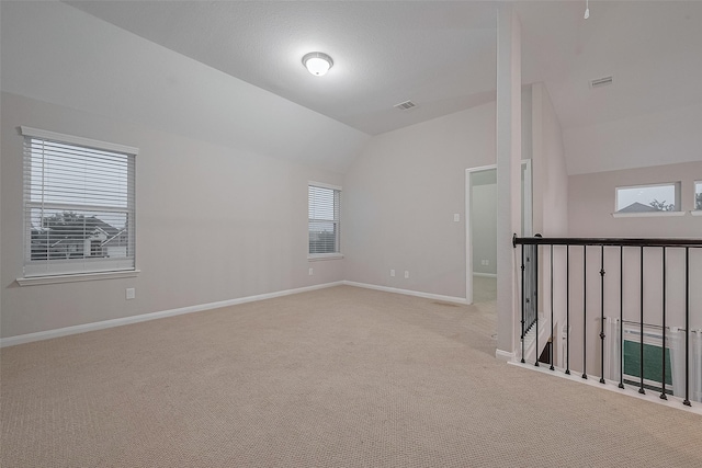 707 Fresh Sage Xing, Richmond, TX 77406 - carpeted empty room featuring lofted ceiling and baseboards