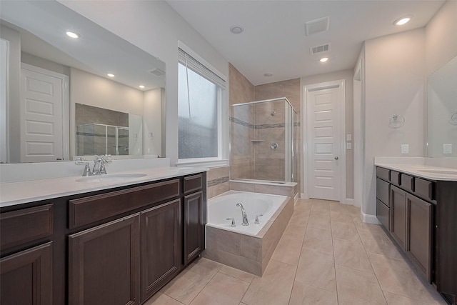 707 Fresh Sage Xing, Richmond, TX 77406 - bathroom with a stall shower, a bath, two vanities, and recessed lighting