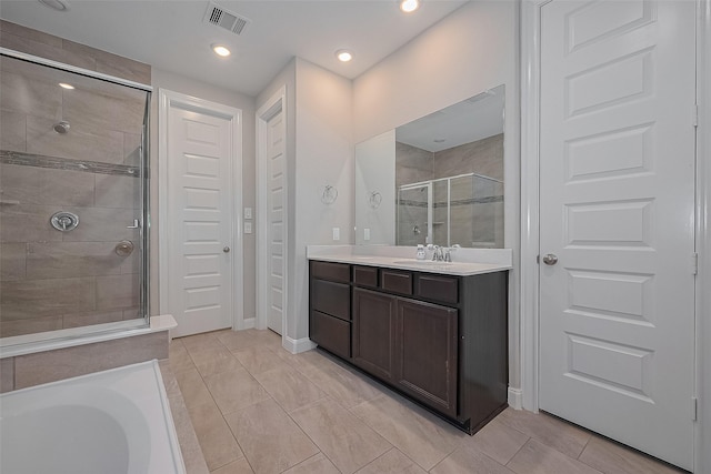 707 Fresh Sage Xing, Richmond, TX 77406 - bathroom featuring a stall shower, vanity, baseboards, and recessed lighting