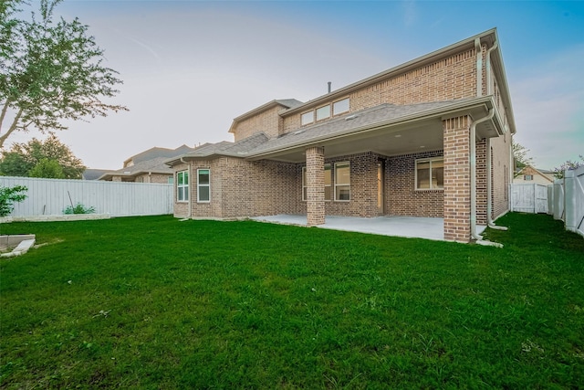 707 Fresh Sage Xing, Richmond, TX 77406 - rear view of property with brick siding and a patio area