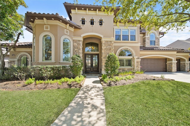 7106 Sentinel Fls, Missouri City, TX 77459 - mediterranean / spanish-style house with stucco siding, french doors, and stone siding