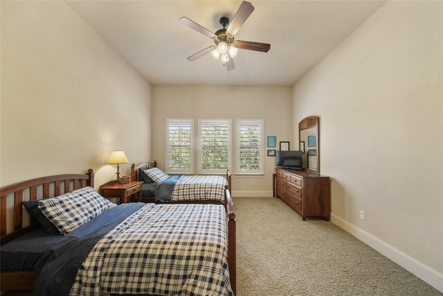 7106 Sentinel Fls, Missouri City, TX 77459 - bedroom featuring light colored carpet, baseboards, and a ceiling fan