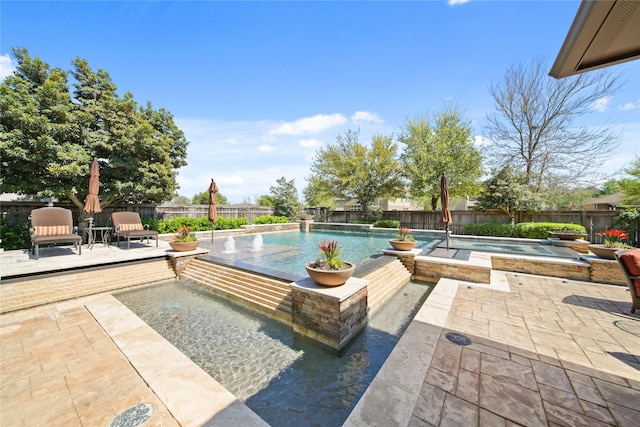 7106 Sentinel Fls, Missouri City, TX 77459 - view of patio featuring a fenced backyard and a pool with connected hot tub