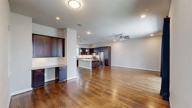 1913 Hickory St, Houston, TX 77007 - unfurnished living room featuring dark wood-style floors, a ceiling fan, baseboards, and recessed lighting