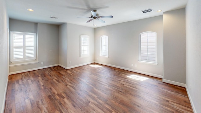1913 Hickory St, Houston, TX 77007 - empty room featuring plenty of natural light, ceiling fan, baseboards, wood finished floors, and recessed lighting