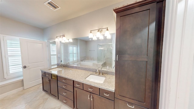 1913 Hickory St, Houston, TX 77007 - bathroom with tile patterned flooring, double vanity, a garden tub, and baseboards