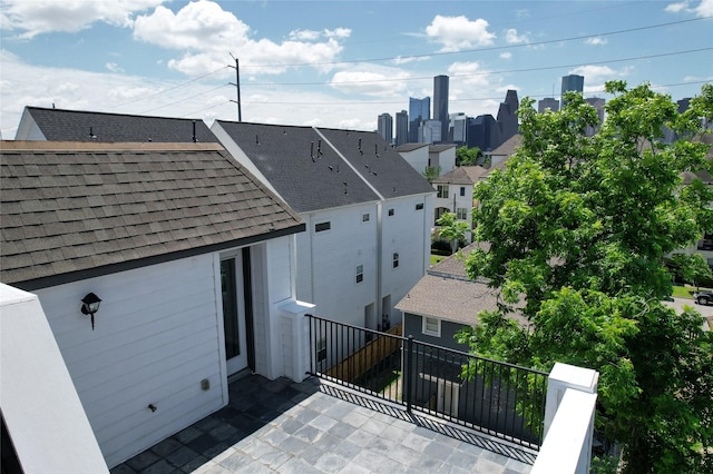 1913 Hickory St, Houston, TX 77007 - back of house featuring a balcony and roof with shingles
