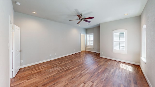 1913 Hickory St, Houston, TX 77007 - spare room with wood finished floors, a ceiling fan, a smoke detector, baseboards, and recessed lighting