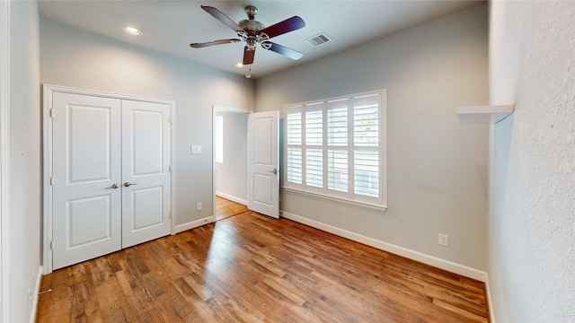 1913 Hickory St, Houston, TX 77007 - unfurnished bedroom featuring wood finished floors, baseboards, a closet, ceiling fan, and recessed lighting