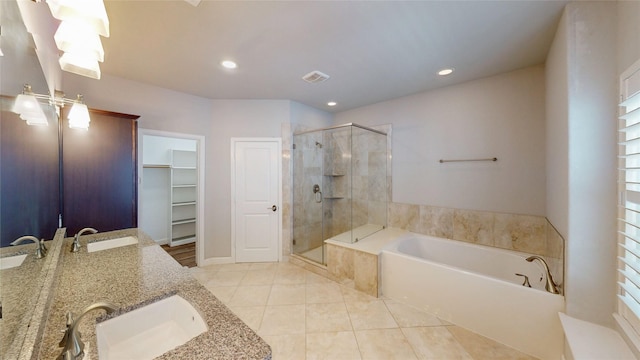 1913 Hickory St, Houston, TX 77007 - full bath with a shower stall, a bath, tile patterned floors, a spacious closet, and double vanity