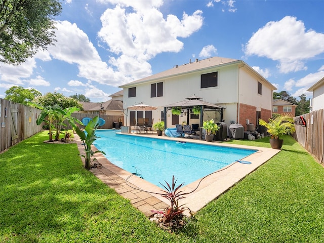 11823 Elizabeth Ct, Pinehurst, TX 77362 - view of swimming pool with a gazebo, a patio area, and area for grilling