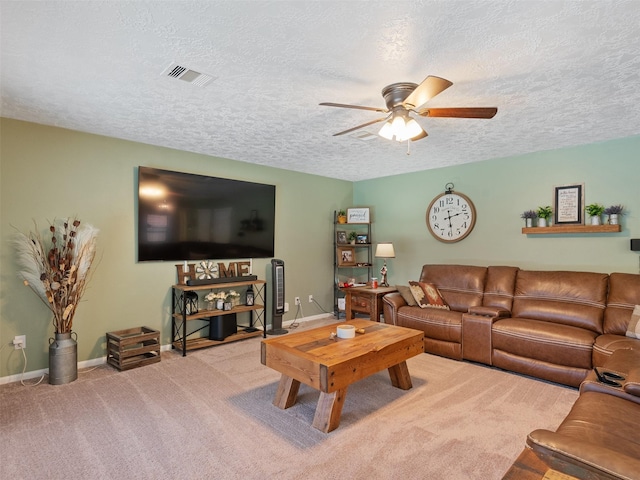 11823 Elizabeth Ct, Pinehurst, TX 77362 - living area featuring ceiling fan, carpet, a textured ceiling, and baseboards