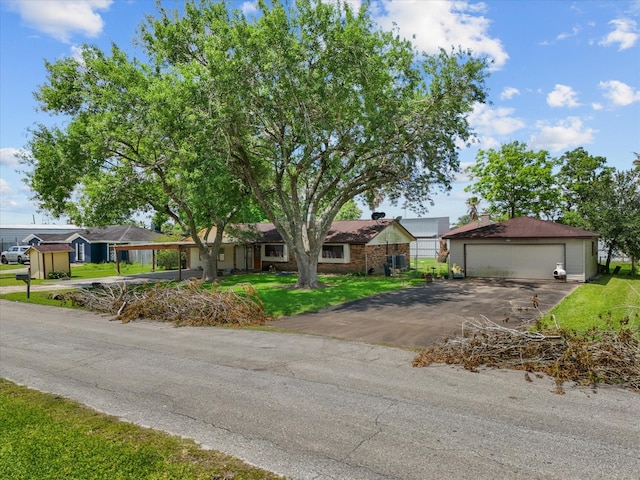3628 Avenue E 1/2 Ave E 1/2, Santa Fe, TX 77510 - single story home featuring a garage, a front lawn, and an outbuilding