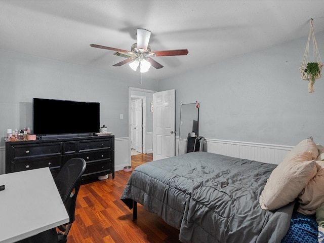 3628 Avenue E 1/2 Ave E 1/2, Santa Fe, TX 77510 - bedroom with wood finished floors, a wainscoted wall, and a ceiling fan