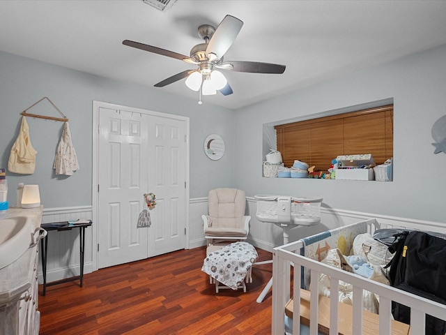 3628 Avenue E 1/2 Ave E 1/2, Santa Fe, TX 77510 - bedroom featuring wood finished floors, wainscoting, a ceiling fan, and a closet
