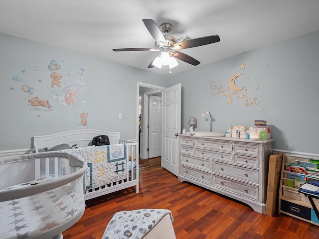 3628 Avenue E 1/2 Ave E 1/2, Santa Fe, TX 77510 - bedroom featuring a nursery area, wood finished floors, and a ceiling fan