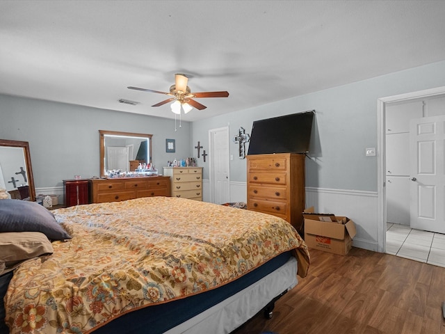 3628 Avenue E 1/2 Ave E 1/2, Santa Fe, TX 77510 - bedroom with a wainscoted wall, wood finished floors, and a ceiling fan