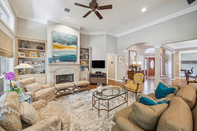 3923 Drake St, Houston, TX 77005 - living room with decorative columns, healthy amount of natural light, a ceiling fan, ornamental molding, and recessed lighting
