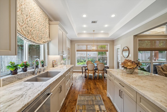 3923 Drake St, Houston, TX 77005 - kitchen with a sink, stainless steel dishwasher, dark wood-style floors, light stone counters, and recessed lighting