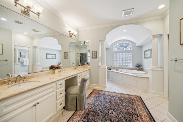 3923 Drake St, Houston, TX 77005 - bathroom featuring ornate columns, a garden tub, tile patterned flooring, double vanity, and recessed lighting