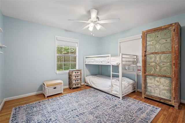 3803 Sunset Blvd, West University Place, TX 77005 - bedroom with wood finished floors, baseboards, and a ceiling fan