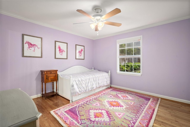 3803 Sunset Blvd, West University Place, TX 77005 - bedroom featuring ornamental molding, baseboards, wood finished floors, and a ceiling fan