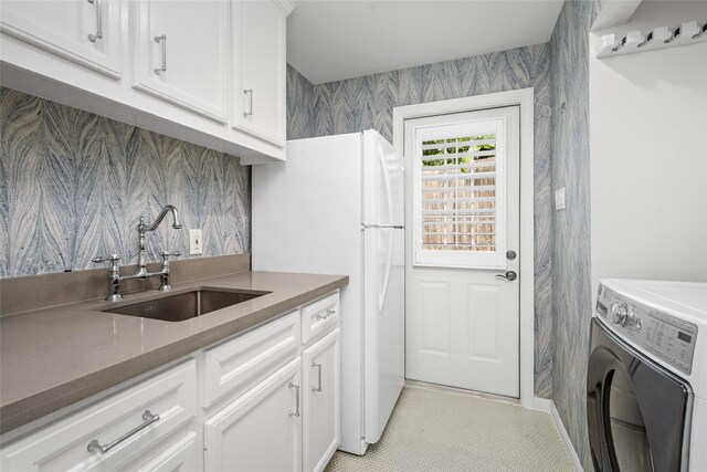 3803 Sunset Blvd, West University Place, TX 77005 - washroom with washer / dryer and a sink
