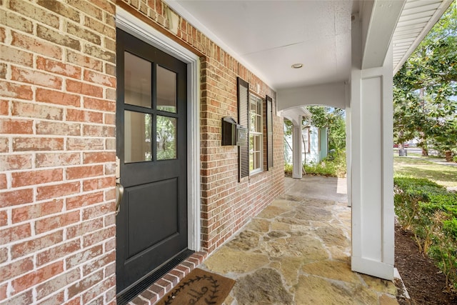 3803 Sunset Blvd, West University Place, TX 77005 - view of exterior entry featuring a porch and brick siding