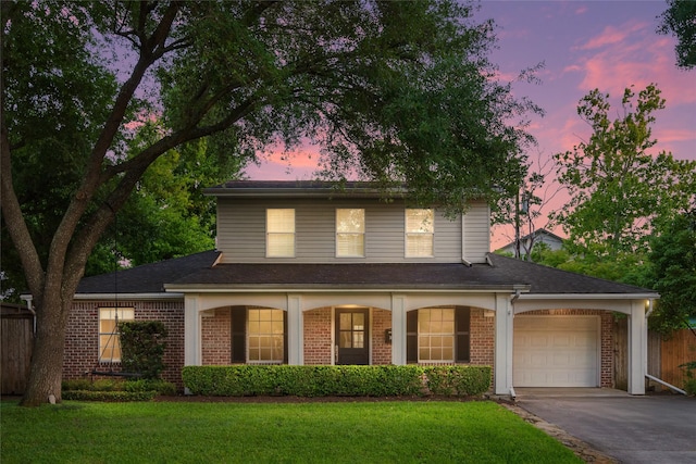 3803 Sunset Blvd, West University Place, TX 77005 - traditional-style home featuring asphalt driveway, a garage, brick siding, and a porch