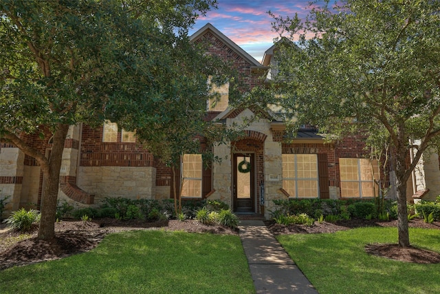 9135 Solvista Pass Ln, Houston, TX 77070 - view of front of house with a yard, brick siding, and stone siding
