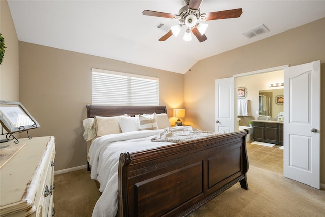 9135 Solvista Pass Ln, Houston, TX 77070 - bedroom featuring ensuite bath, light carpet, lofted ceiling, ceiling fan, and baseboards