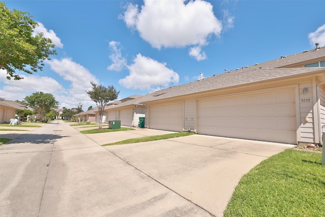 9135 Solvista Pass Ln, Houston, TX 77070 - view of front of property with concrete driveway, an attached garage, and a residential view